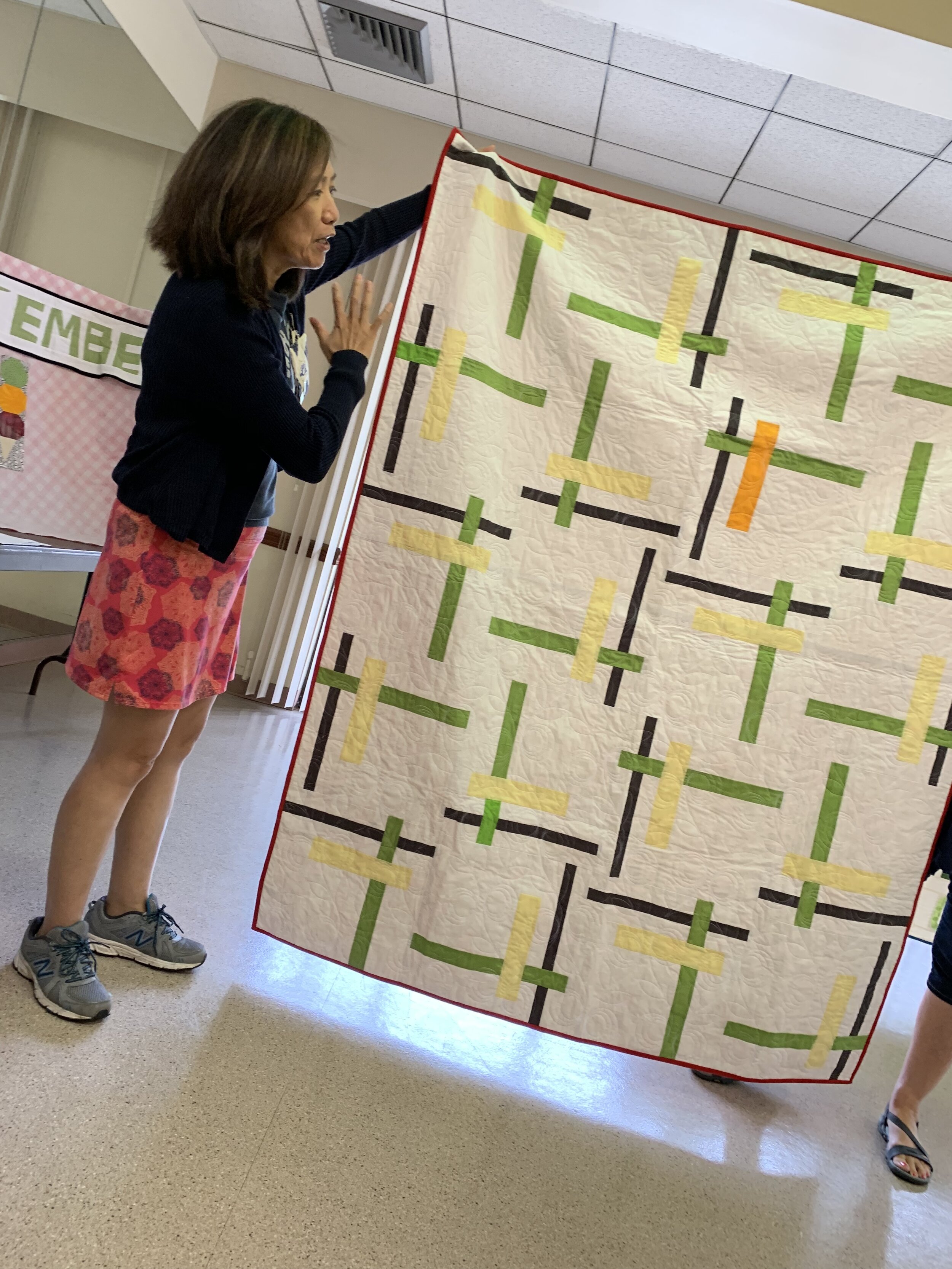  Li discussed what longarmers do and how to prepare your quilts. 
