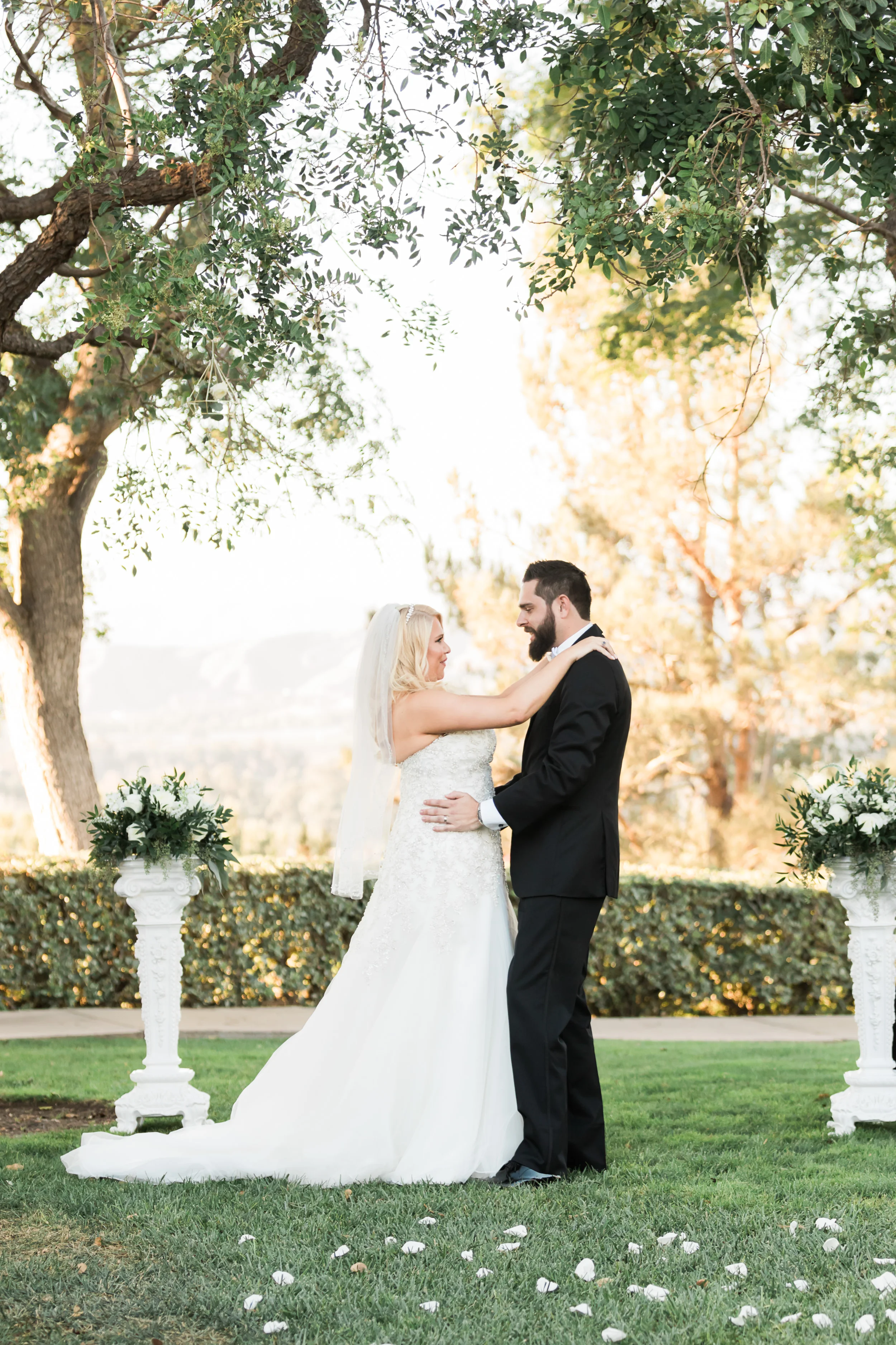 Bride and groom had a stunning navy and gold fall wedding at Spanish Hills in Camarillo, CA. The white florals and greenery were the perfect touch throughout the SoCal venue, reception decor and centerpieces. This fall wedding has affordable wedding DIYs ideas that look more luxe than they are. This is a must save! Planning:@janealexandraevents | Photography: @KJacksonPhoto | Florals: @velvetblooms #JAE #janealexandraevents #camarilloweddingvenue #weddingplanning #camarillowedding