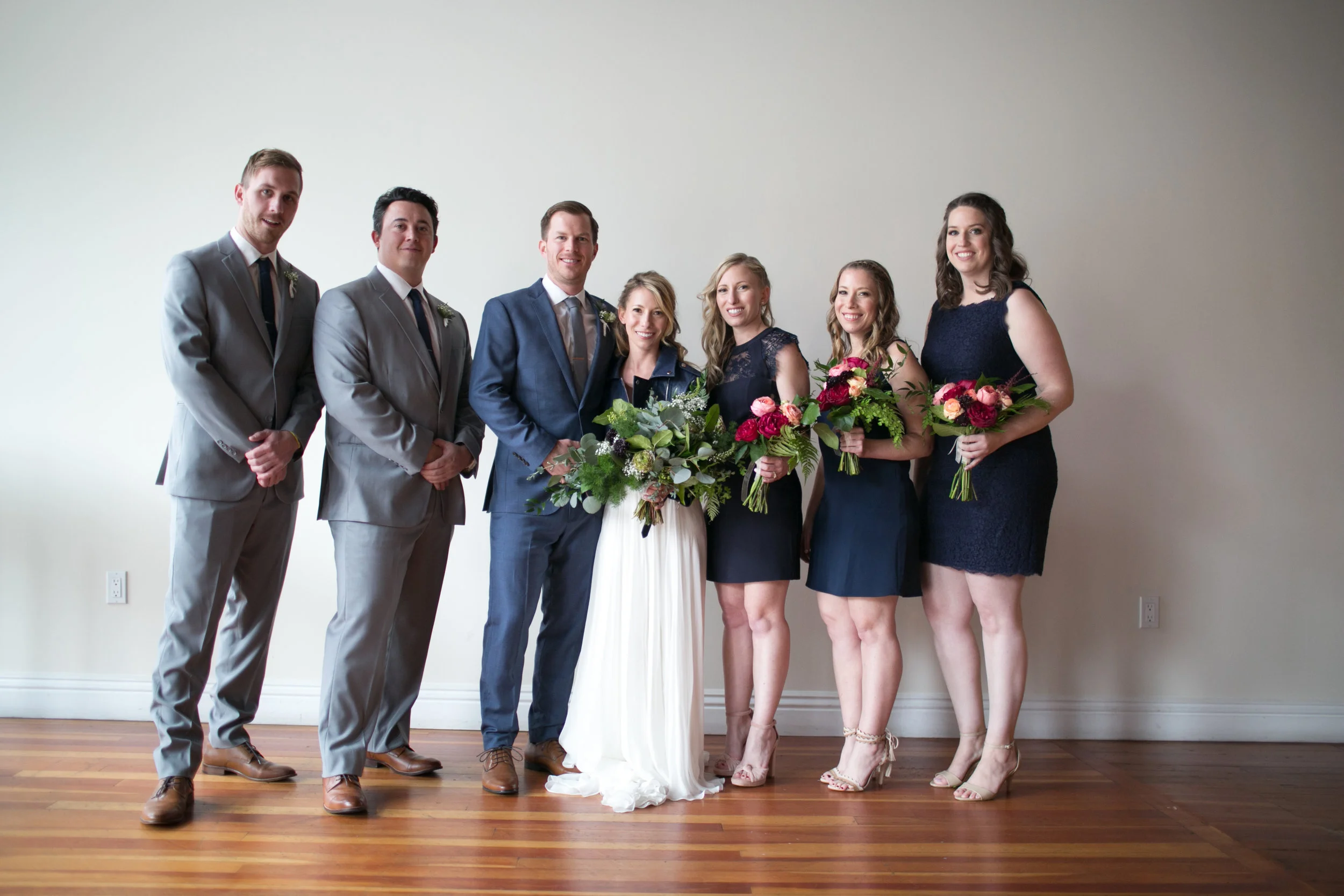 Bride and groom had a stunning navy and green winter wedding at The Loft On Pine in Long Beach, CA. The pops of rich colors matched the venues industrial vibe and the bride's giant bouquet of wild greens was pretty epic. The flowy BHLDN two piece paired with a leather jacket was perfect for the cooler weather but also looked pretty badass. Planning:@janealexandraevents Venue:@theloftonpine #JAE #longbeachweddingvenue #weddingplanning #theloftonpine #winterweddingideas