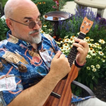 Tim strumming away in his free time.