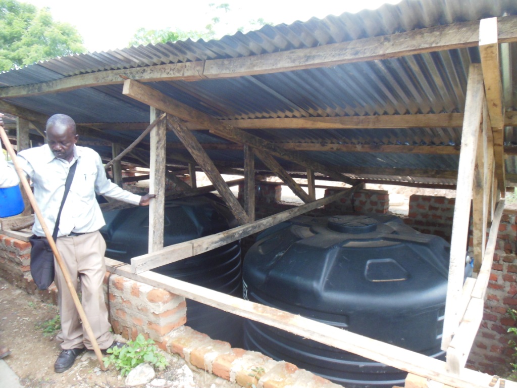 Roof water storage tanks which are part of a greenhouse irrigation system to grow food for disabled Ugandan children attending a boarding school in Kitgum, UG.