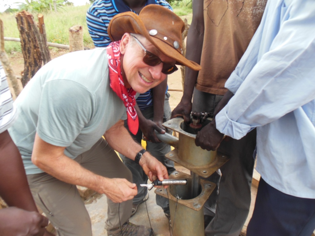 Tom inserts the first In-Situ transducer into the Moroto West well near Palbek, UG, in the far north.