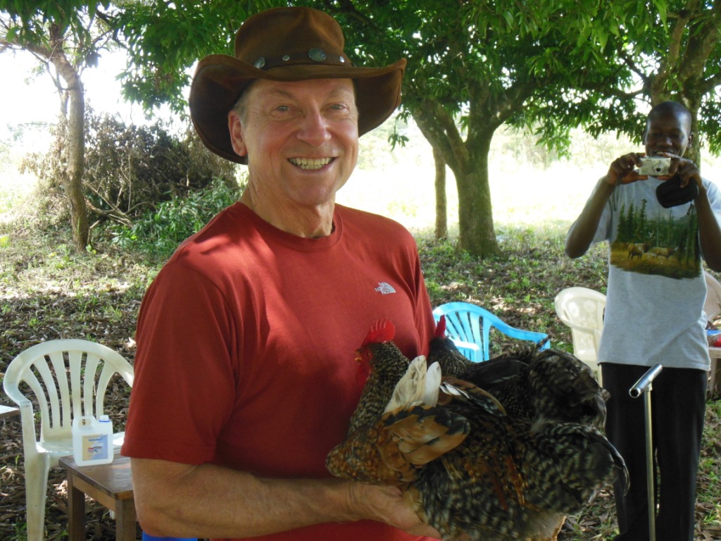 Two chickens presented to Tom and Hope 2 One Life team from Awere village.