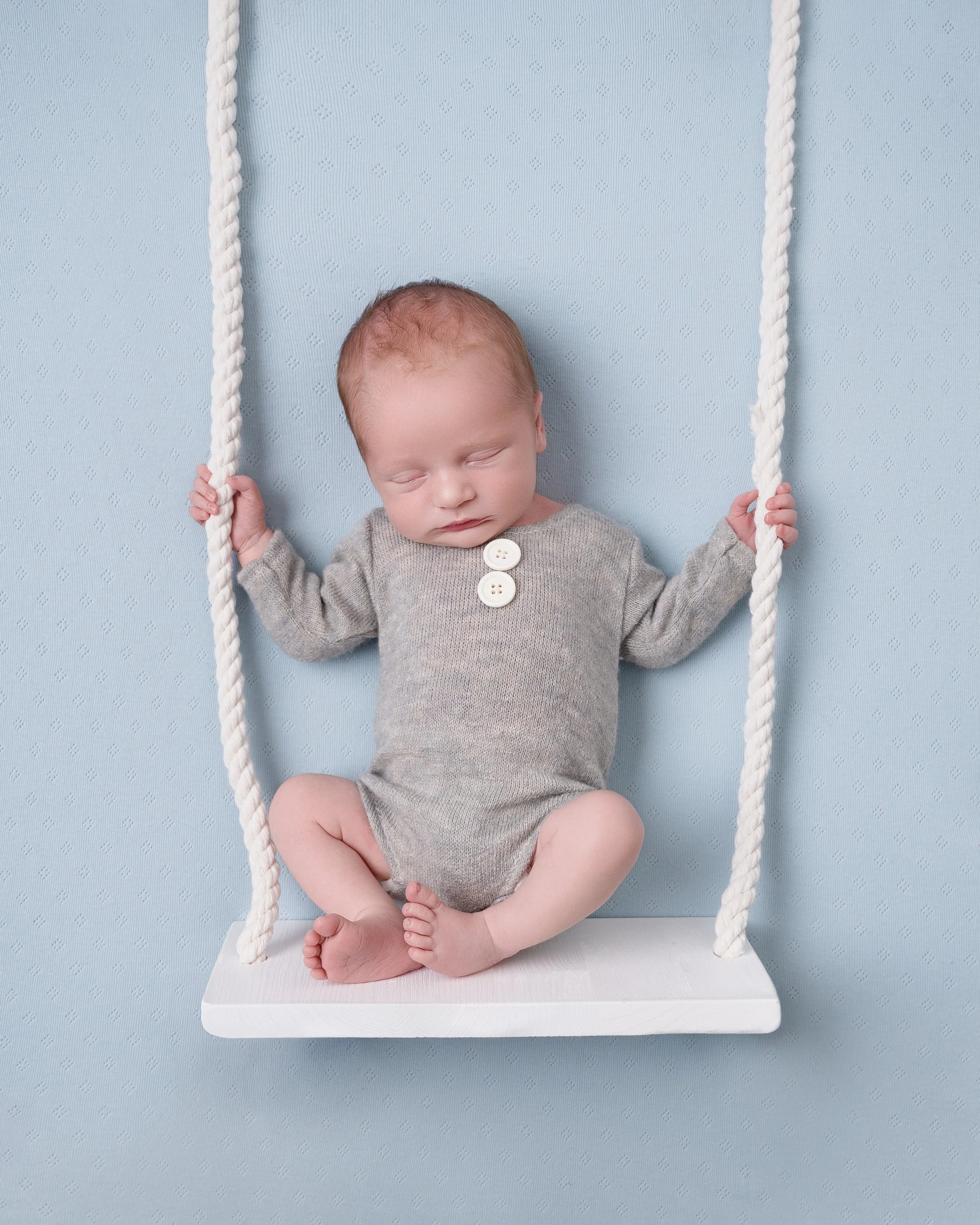 newborn-boy-blue-swing-photographer-west-london.jpg