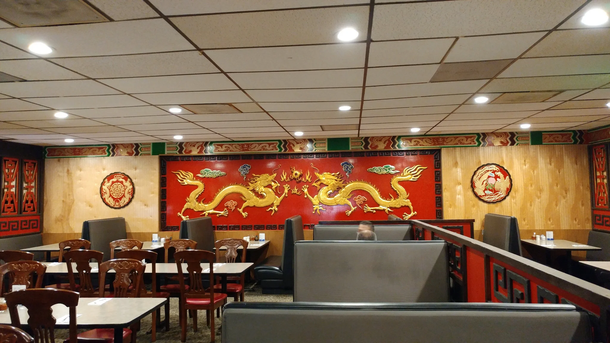 The original wall art remains, gleaming under much brighter lighting.