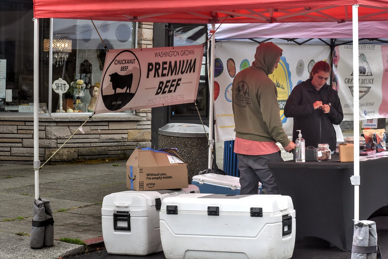 Chuckanut Beef booth with a Washington Grown Premium Beef banner and coolers at the Everett Farmers Market