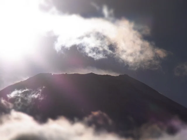  The dark summit stands out in the dazzling light and freezing cold morning air 