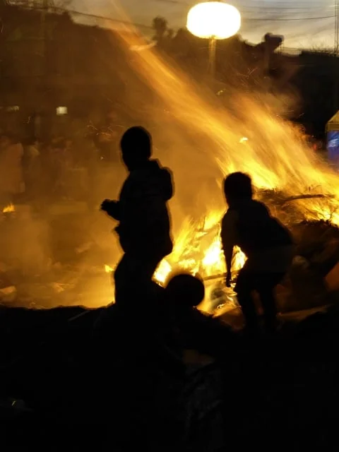  Kids gazing at the blazing New Year's bonfire 