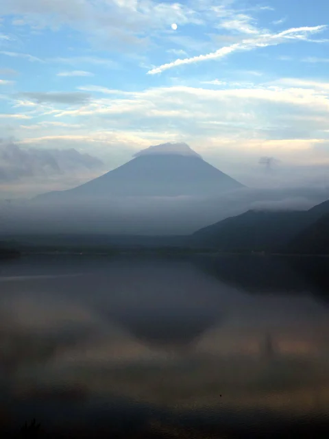  'Sakasafuji', inverted reflection of Mt. Fuji, dimly seen on the lake surface at Lake Motosuko 