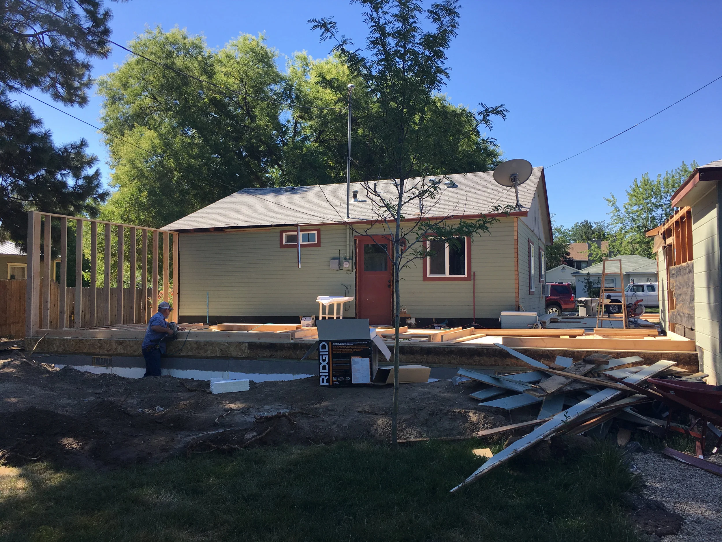 June 2016: foundation and framing going on around our tiny 700-square foot home.