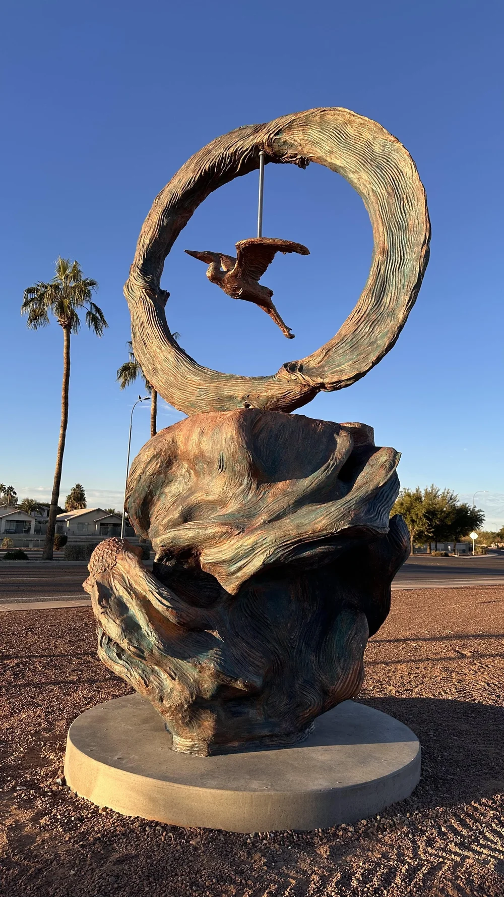 Nexus: A Harmony of Rivers, the finished kinetic sculpture with its heron at Fire Station 172 in Avondale