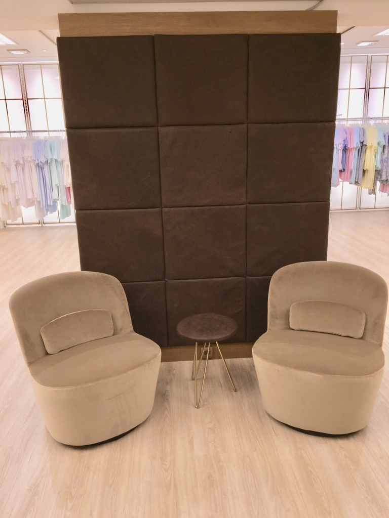Visitor corner at Lingerie/Dessous store. Velvet 60` chairs on moveable/rotatable platform. Pure vegetable tanned leather application placed on room divider. Design: Ralph Budwell (www.budwell-creations.com)