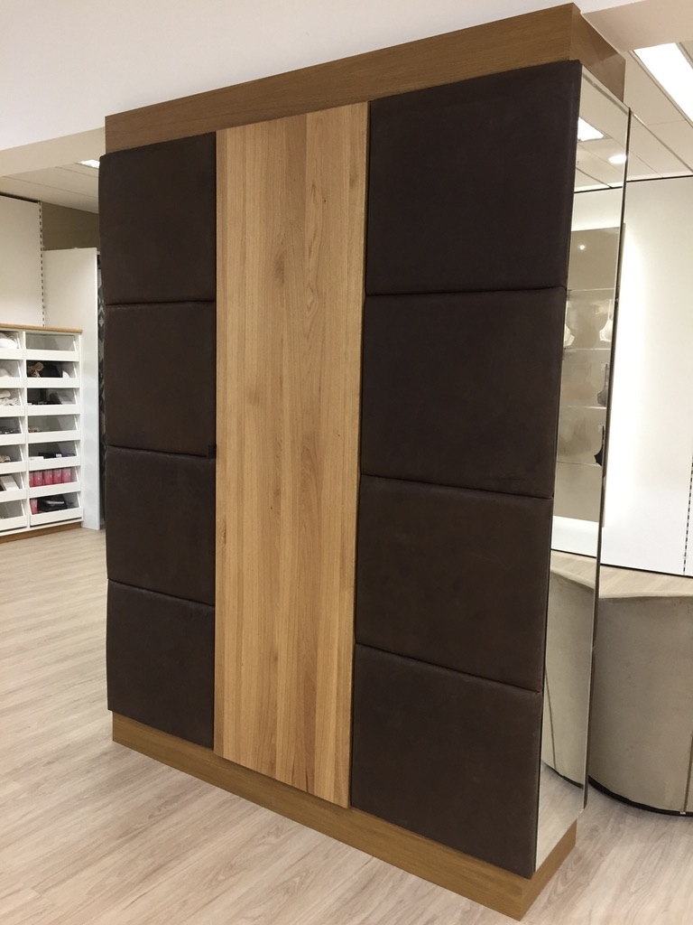 Wardrobe/ room divider with integrated shelving. Designed around - embedded brick column. Front door: natural Austrian oak wood, oiled. Left and right application, cassette system - handcrafted covered with natural vegetable tanned buffalo leather