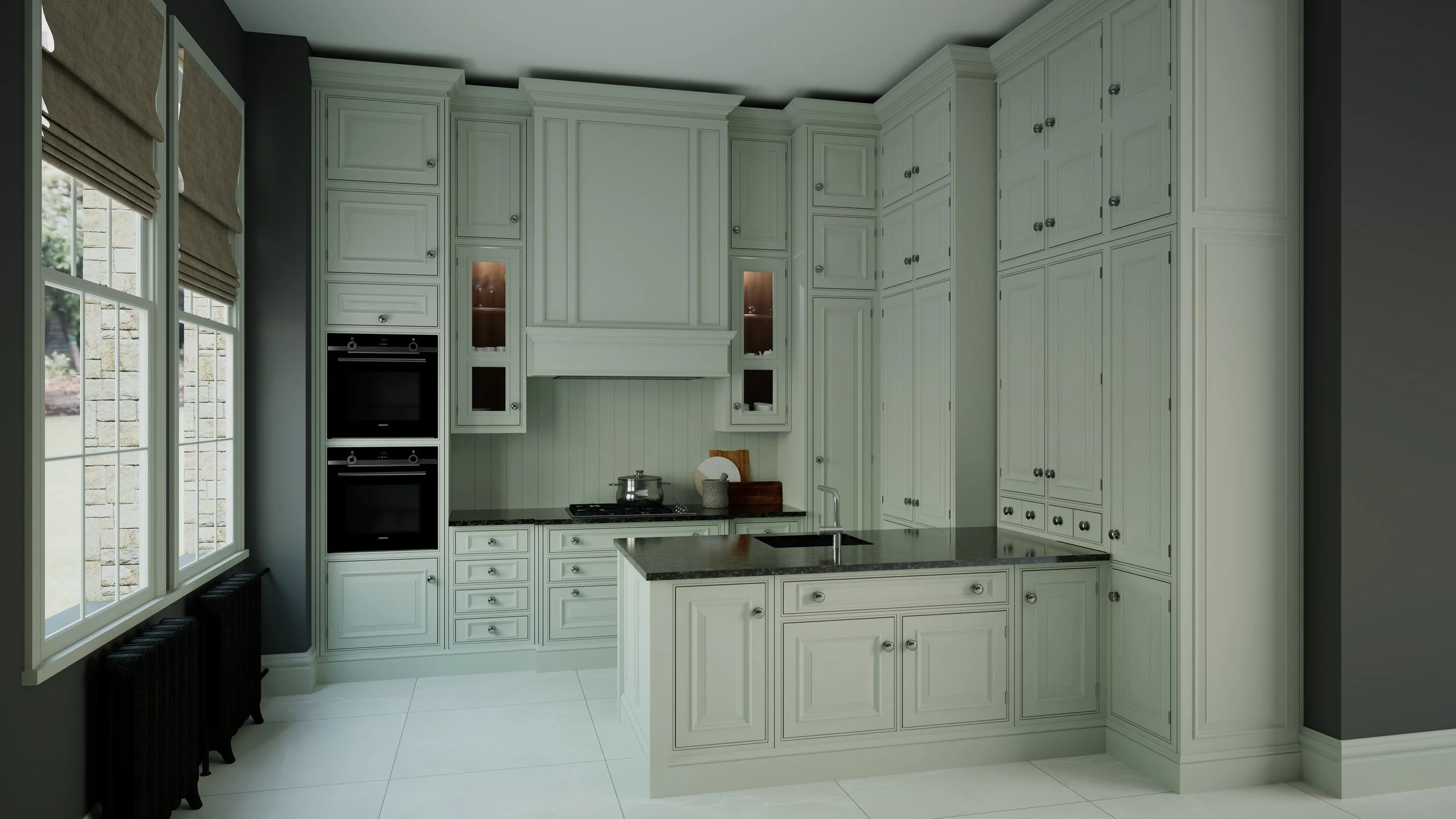 Classic shaker kitchen in soft green with tall cabinetry and a central island.
