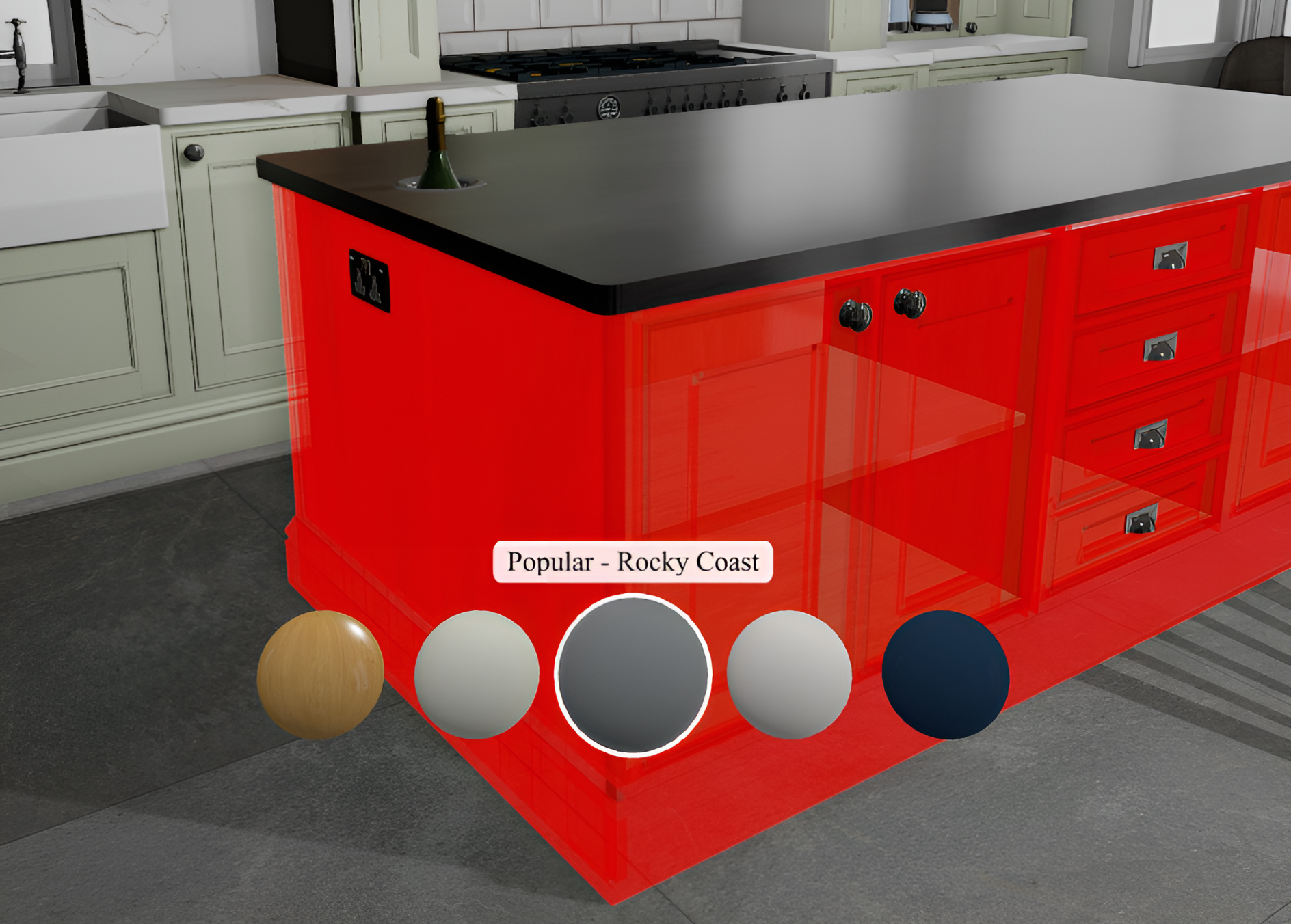 A modern kitchen featuring a red kitchen island with black countertop, several drawers with metallic handles, against a backdrop of pale green cabinets, a stove, and a window. There is a picture of a champagne bottle on the island's surface and various colored spheres at the bottom indicating color options.
