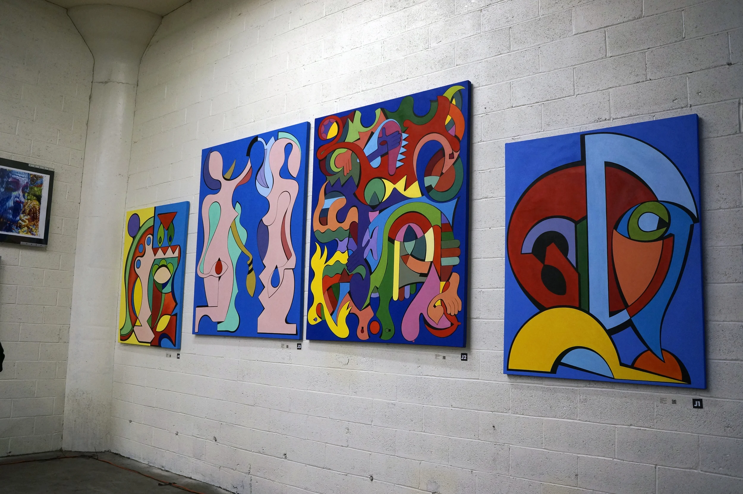 Four works at the Lackawanna flagship gallery. (L to R) Portugal , The Women, The Force of Nature, and Arc.