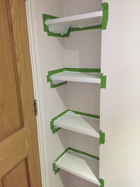 FrogTape around the shelves where they meet the wall before painting to ensure a neat finish.