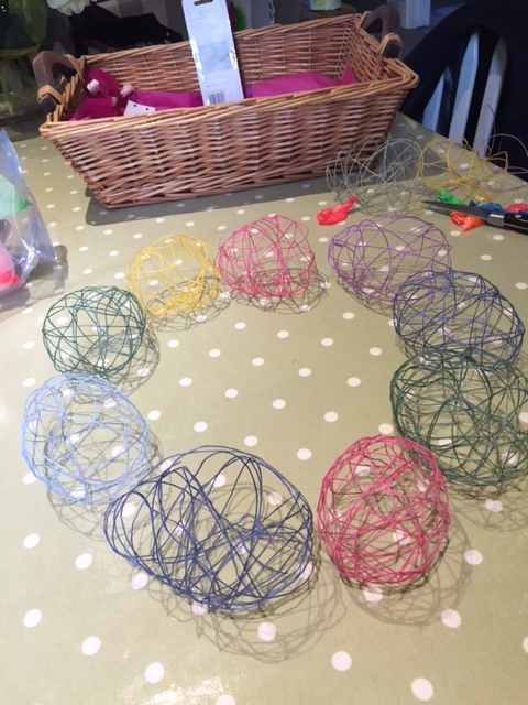 Lay out your balloons into a wreath shape before glue-gunning together.
