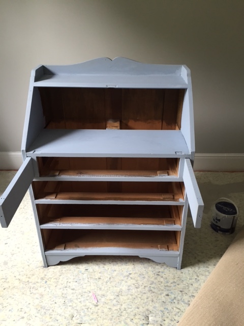 Once your first coat is dry, sand down any drips and apply the second coat.