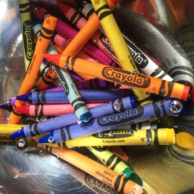 Soak crayons to remove paper sleeves (much easier to peel off this way!).