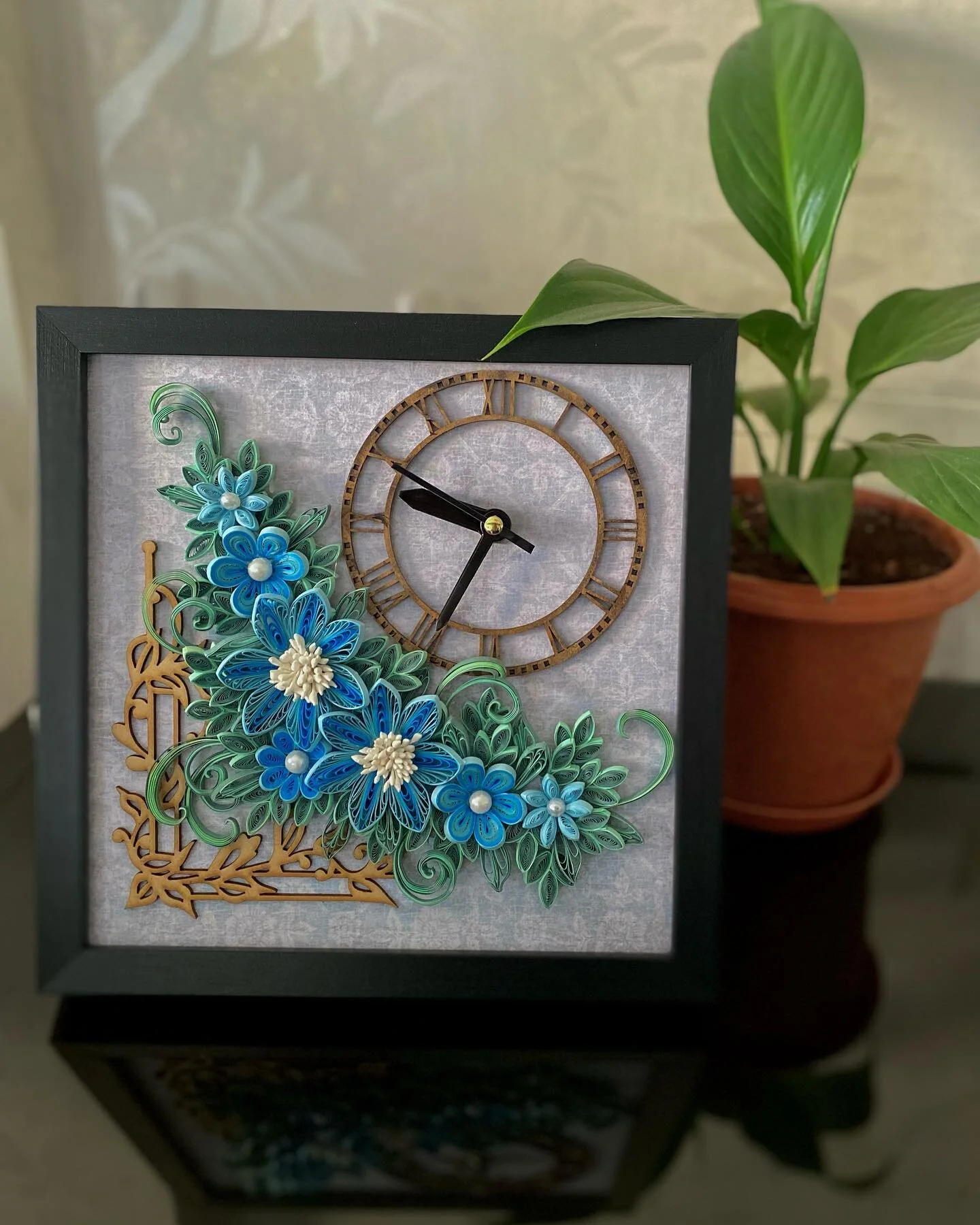 Quilling watch🕥
A gift for someone you love dearly! 
Size 9*9&rdquo; framed 

#quilledflowers #handmadepapergoods #floralart #papercraft #lovepaper #blueflowers #quilledpaperart
