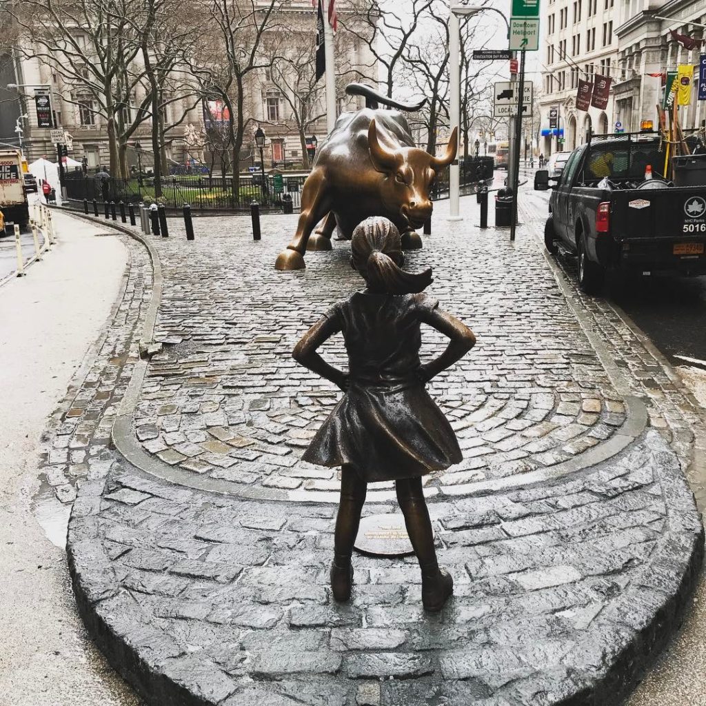 Kristen Visbal's The Fearless Girl statue on Wall Street. Courtesy of Logan Hasson via Instagram.