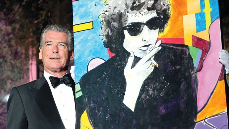 Gisela Schober/Getty Images. Brosnan and his painting in Cannes.