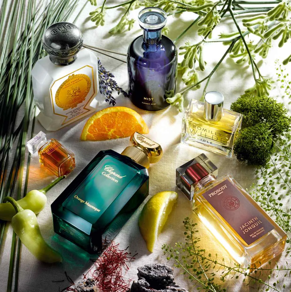 Clockwise from top left: Officine Universelle Buly Tubéreuse du Mexique, £156 for 75ml EDP. Perfumer H Mist, £450 for 100ml EDP. Romilly Wilde Idle, £90 for 30ml EDP. Prosody Jacinth Jonquil, £135 for 50ml EDP. Chopard Orange Mauresque, £240 for 100ml EDP. Aftelier Oud Luban, $185 for 30ml EDP | Image: Omer Knaz via How To Spend It