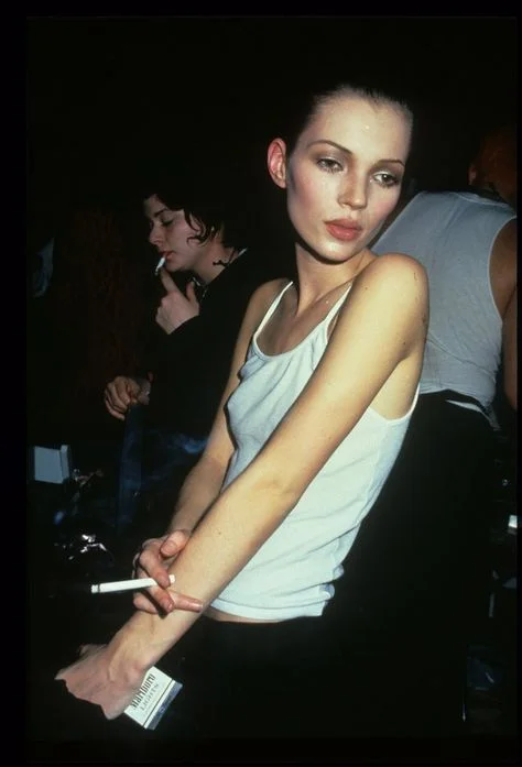 Kate Moss, back in the day as the famous heroin chic fashion industry body.
