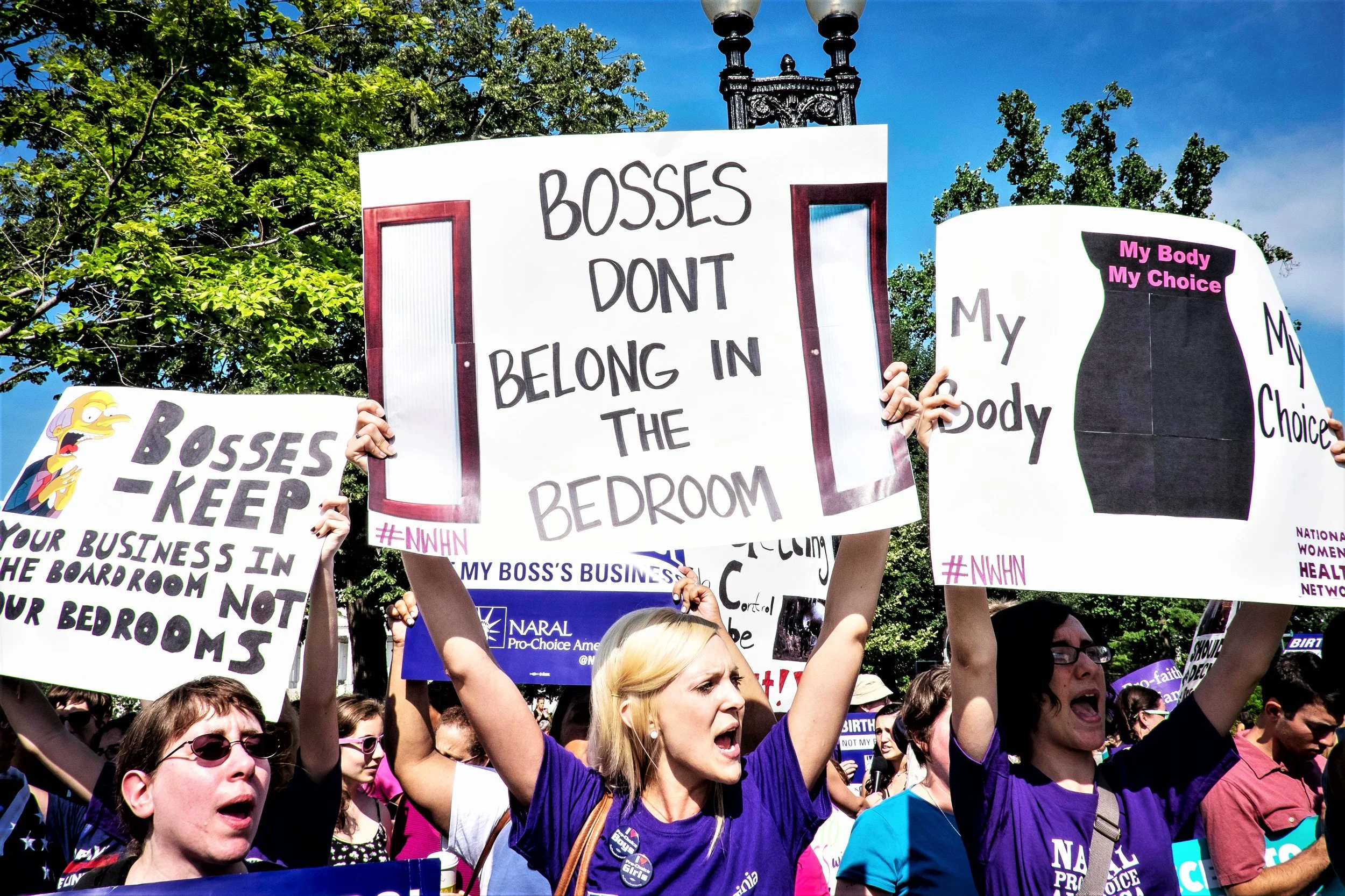 Activists who support the Affordable Care Act's employer contraceptive mandate demonstrate outside of the U.S. Supreme Court.