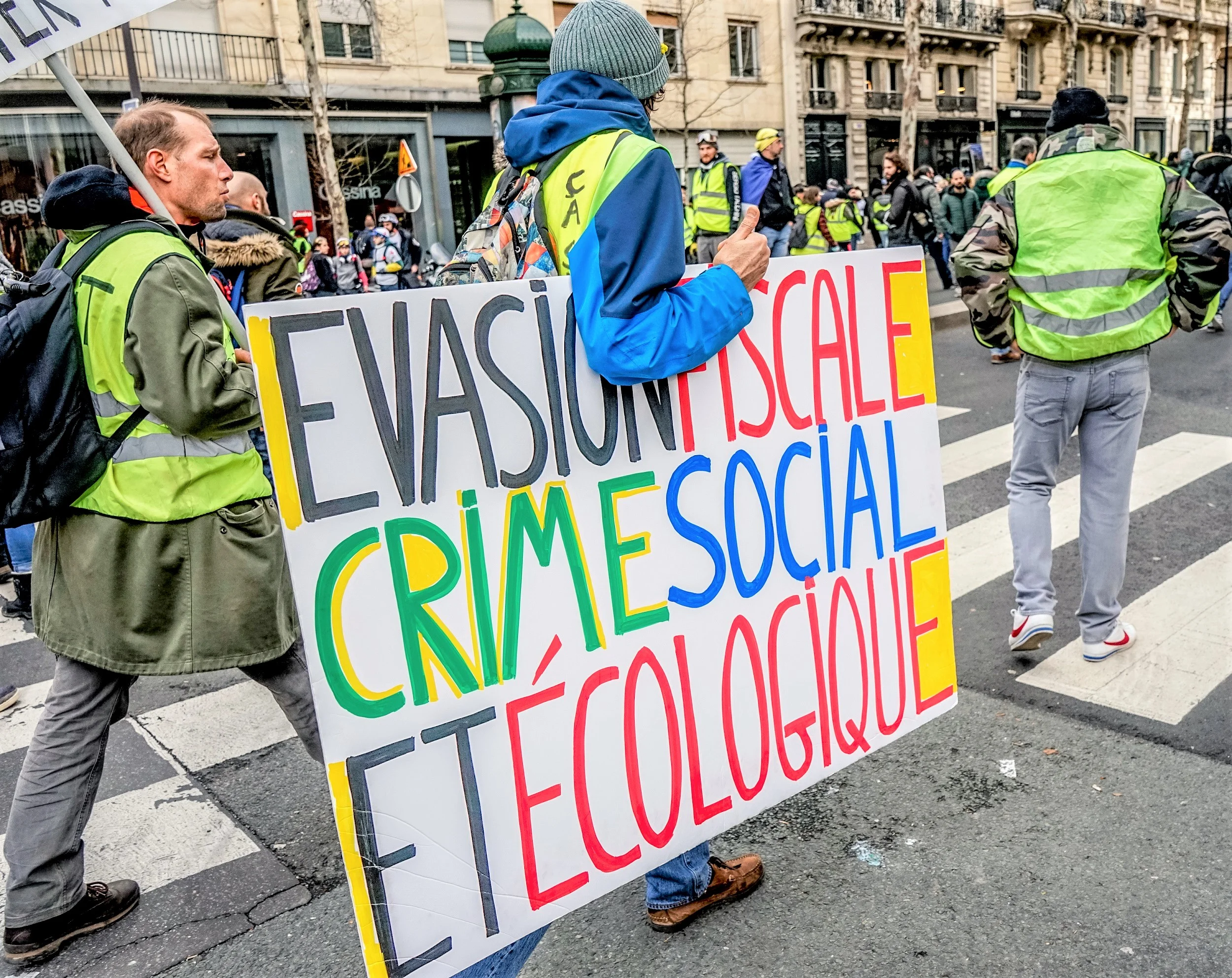THOUSANDS OF YELLOW VESTS (GILETS JAUNES) PROTESTS IN PARIS CALLING FOR LOWER FUEL TAXES, REINTRODUCTION OF THE SOLIDARITY TAX ON WEALTH, A MINIMUM WAGE INCREASE, AND EMMANUEL MACRON'S RESIGNATION AS PRESIDENT OF FRANCE, 09 FEBRUARY 2019. BY NORBU GYACHUNG, CC BY-SA 4.0. VIA WIKI COMMONS.