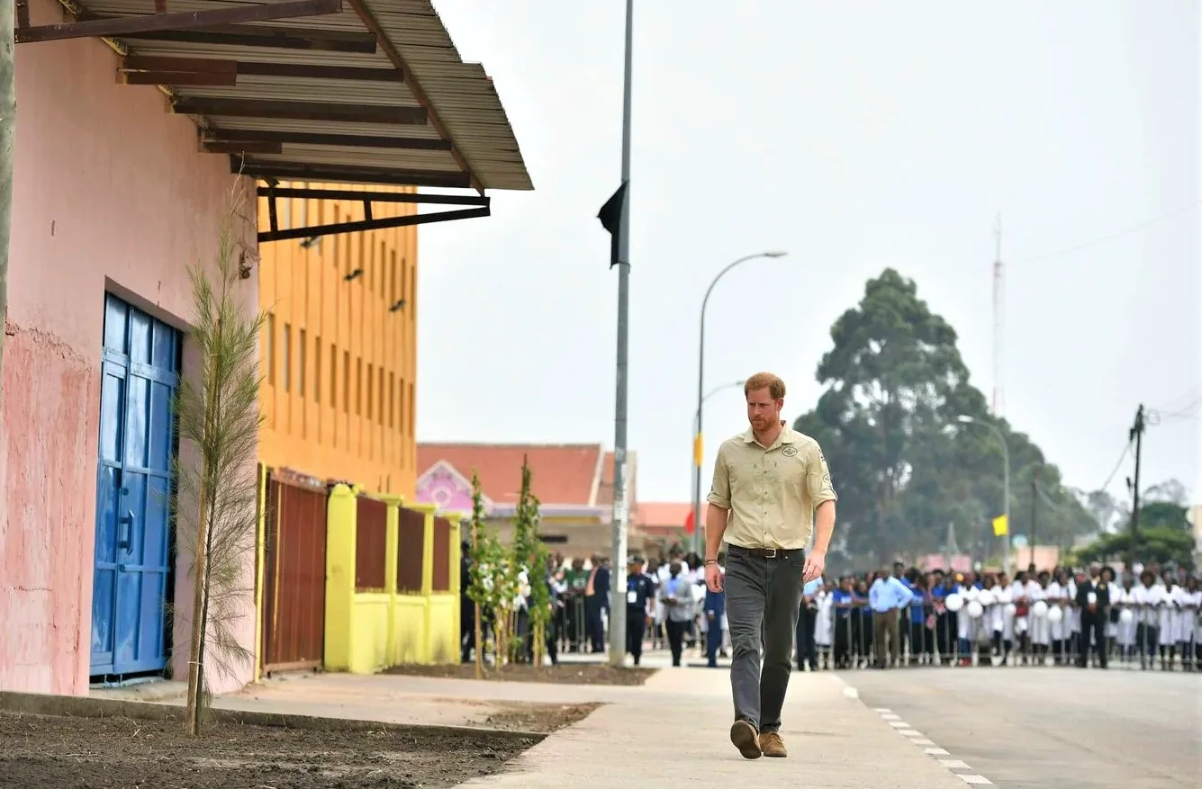 Prince Harry walks down Princess Diana Street in Huambo, Angola, during the royal tour of Africa on Sept. 27. (Dominic Lipinski/Pool/AP) via Washington Post