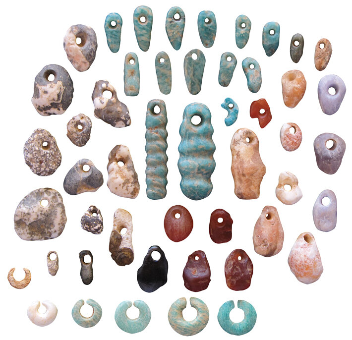  Stone pendants and earrings from the communal cemetery of Lothagam North. Most burials had highly personalized ornaments, but none seemed to distinguish one person above others. (Courtesy of Carla Klehm) 