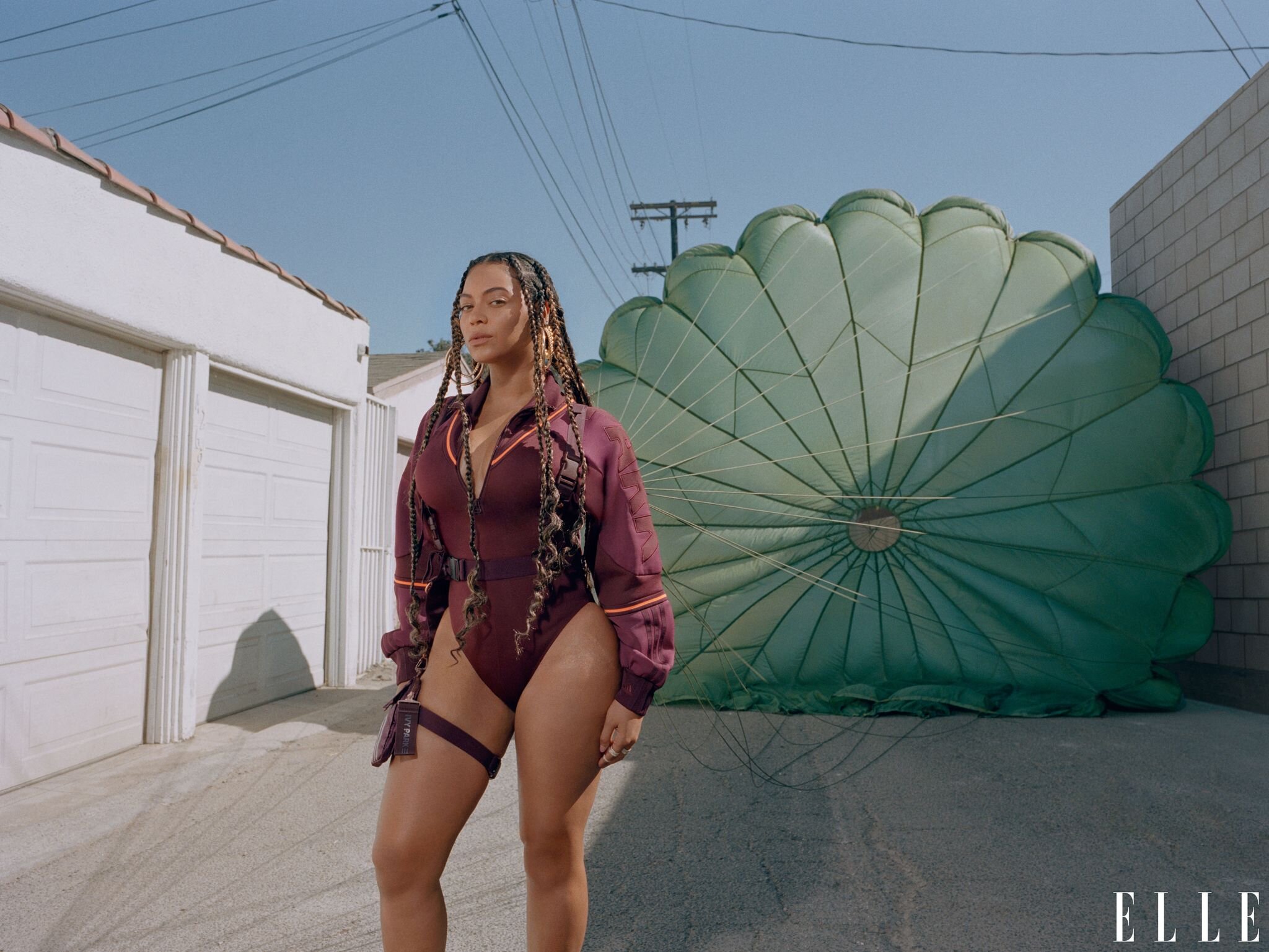  Track top bodysuit, harness bag, both, IVY PARK x adidas. Hoop earrings, Lana Jewelry. Rings, Ofira. Beyonce by Melina Matsoukas for ELLE US January, 2020. 