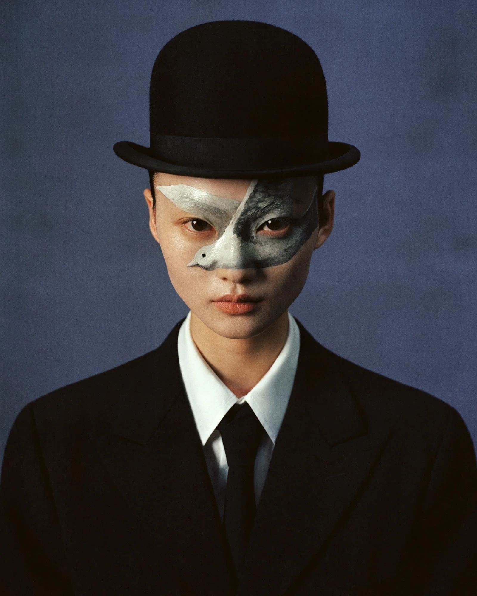  He Cong for Marie Claire China inspired by Rene Magritte  Man in a Bowler Hat.  