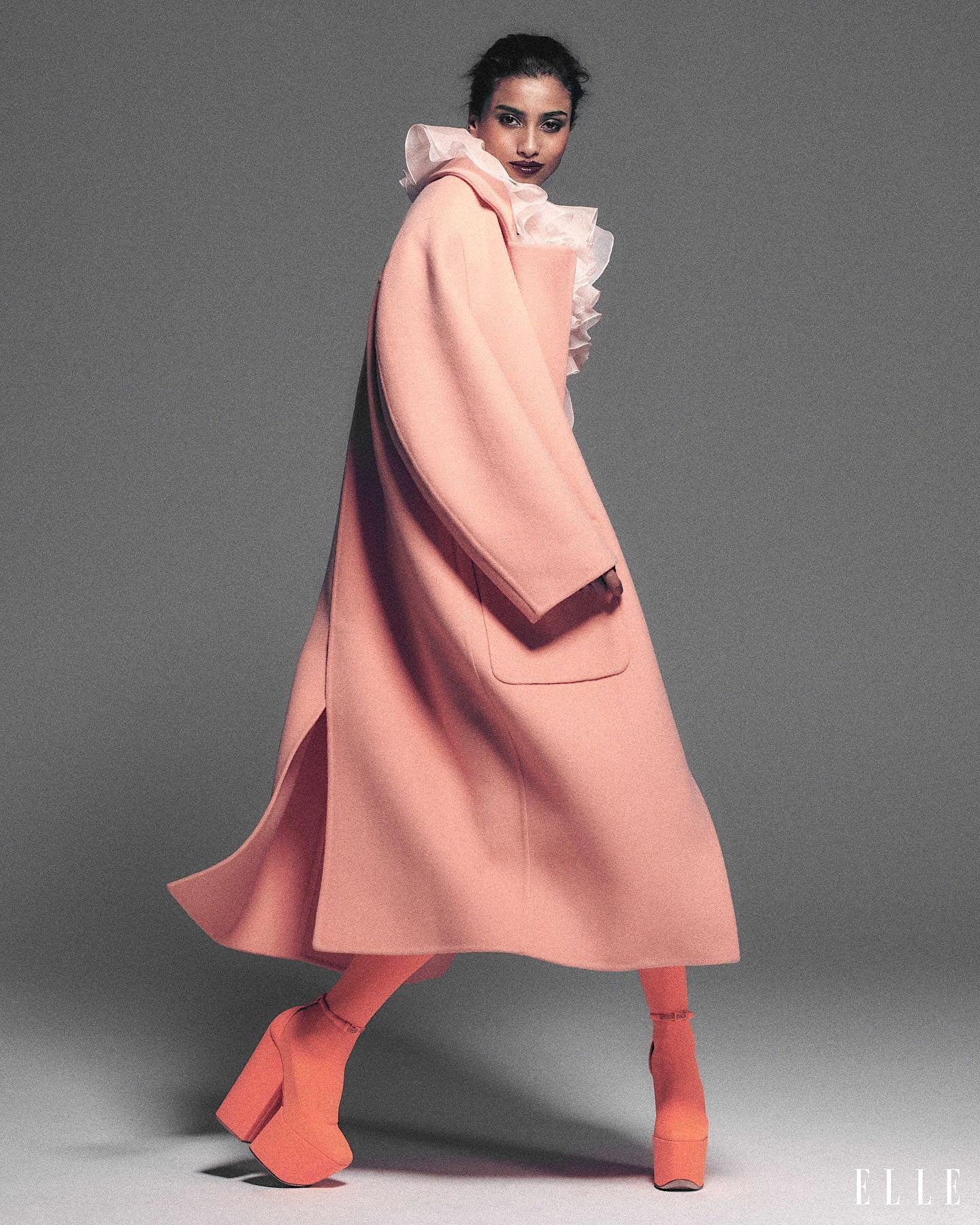 Imaan Hammam in Valentino Couture dress, coat, tights, pumps by Chris Colls ELLE USA August 2023