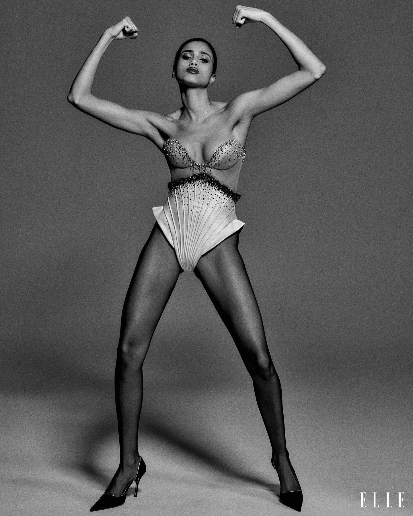 Iman Hammam in corset with draped bodysuit, pumps, Miss Sohee by Chris Colls ELLE USA August 2023