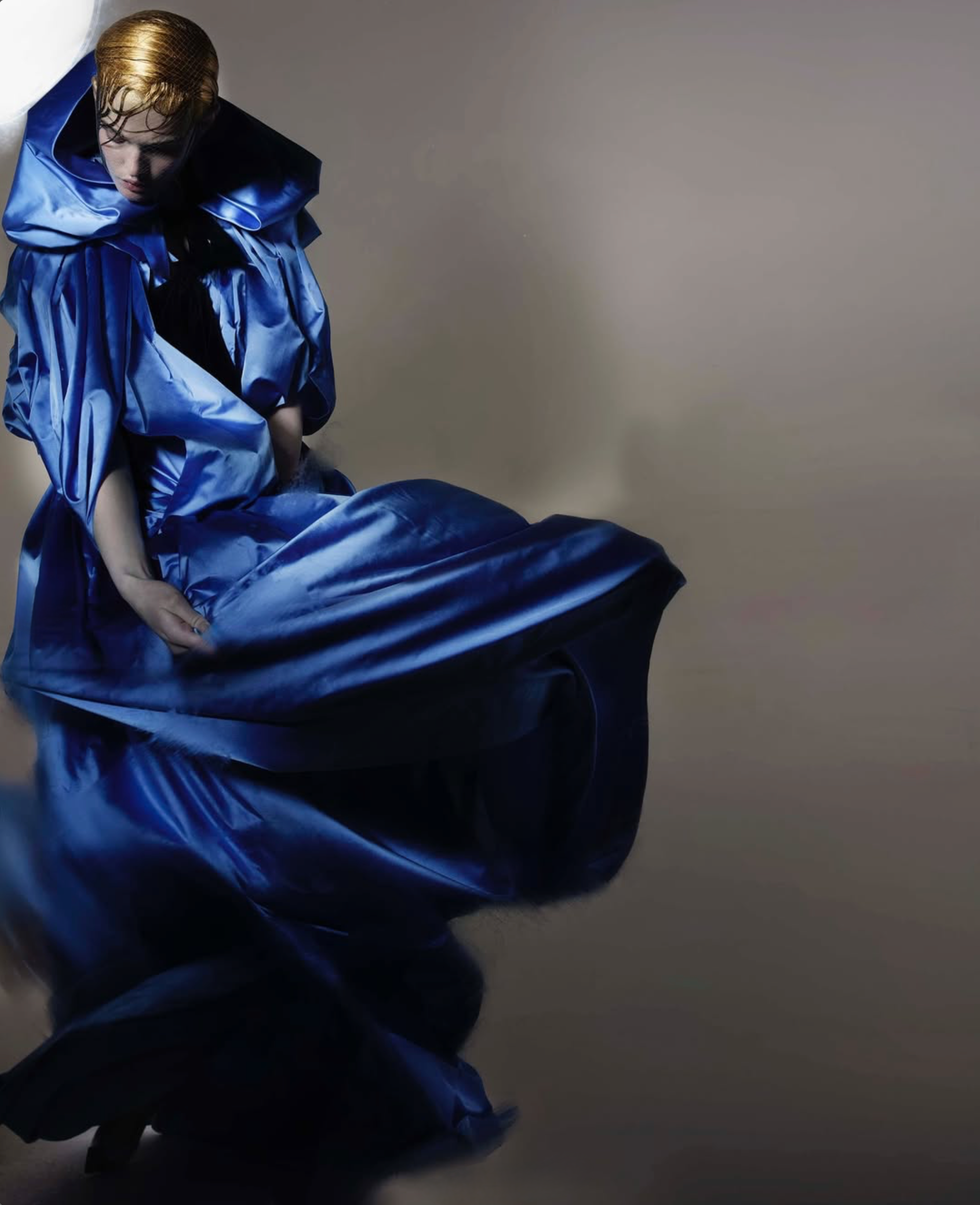 Tenney’s blue cape with velvet bow is from Chanel Haute Couture