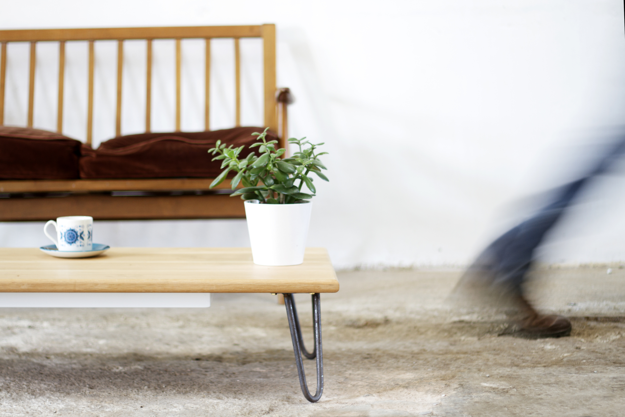 Cord Industries hairpin leg coffee table in oak with lacquered steel legs.