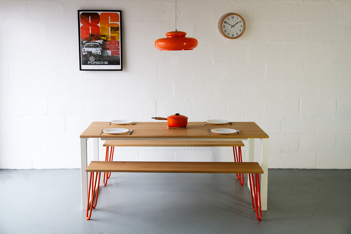 Cord Industries Nola dining table in oak with white legs to seat six (shown with oak benches with orange hairpin legs).