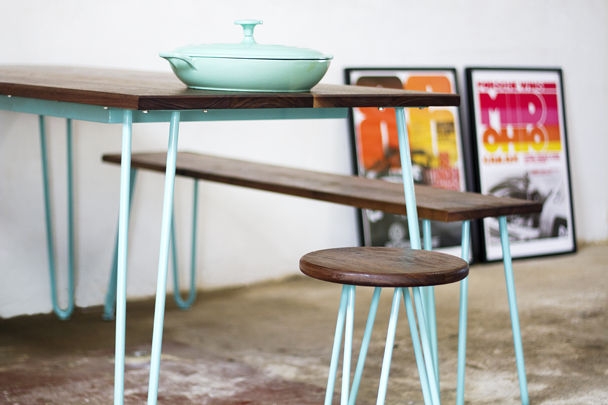 Cord Industries hairpin leg dining set for eight (with benches and stools), in walnut with turquoise legs.