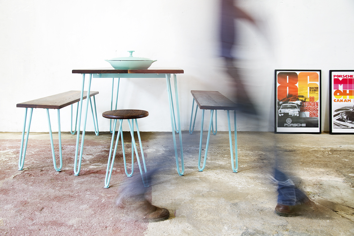 Cord Industries hairpin leg dining set for eight (with benches and stools), in walnut with turquoise legs.