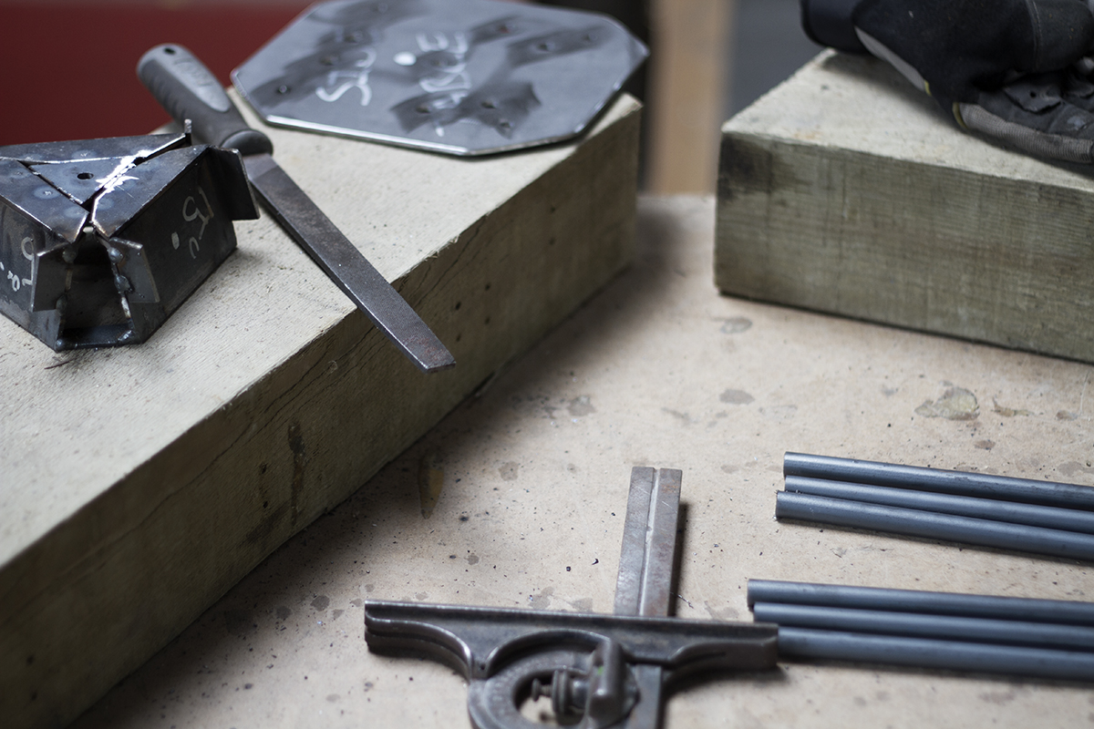 Tools and jigs used in the creation of steel hairpin legs at Cord Industries.