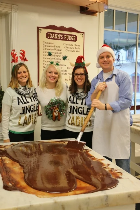 Cameron paddling with some help from the elves
