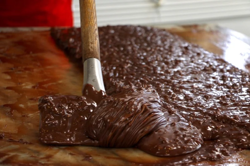 Paddling the fudge helps to cool and set up the loaf.
