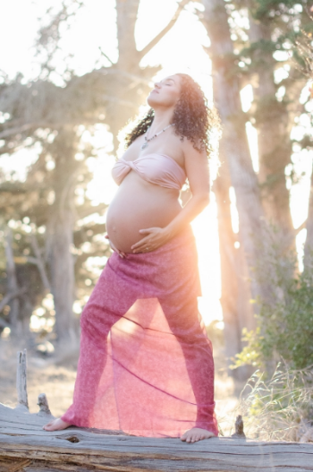 That's a shot from my maternity photoshoot, which my Husband helped style me for, he made my necklace and helped me drape myself in beautiful cloth.