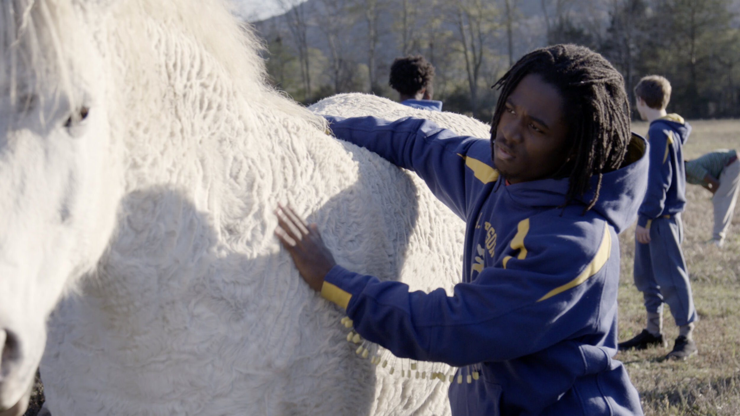 WRESTLE_Jamario Rowe at an equine therapy farm in Alabama.jpg