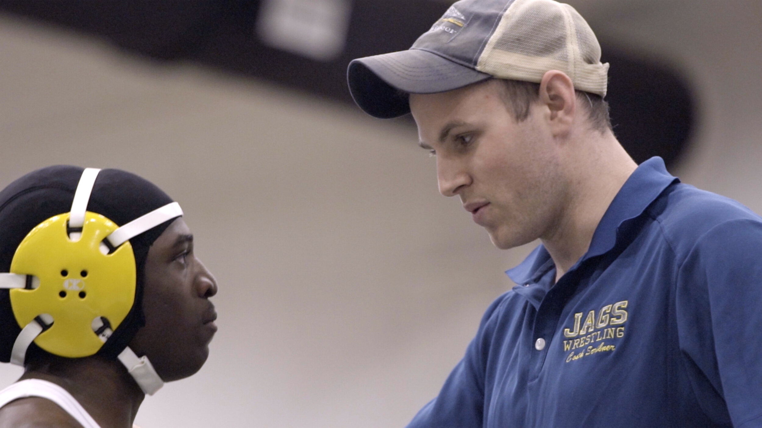 35_WRESTLE_Jamario Rowe gets advice from Coach Scribner during a match.jpg