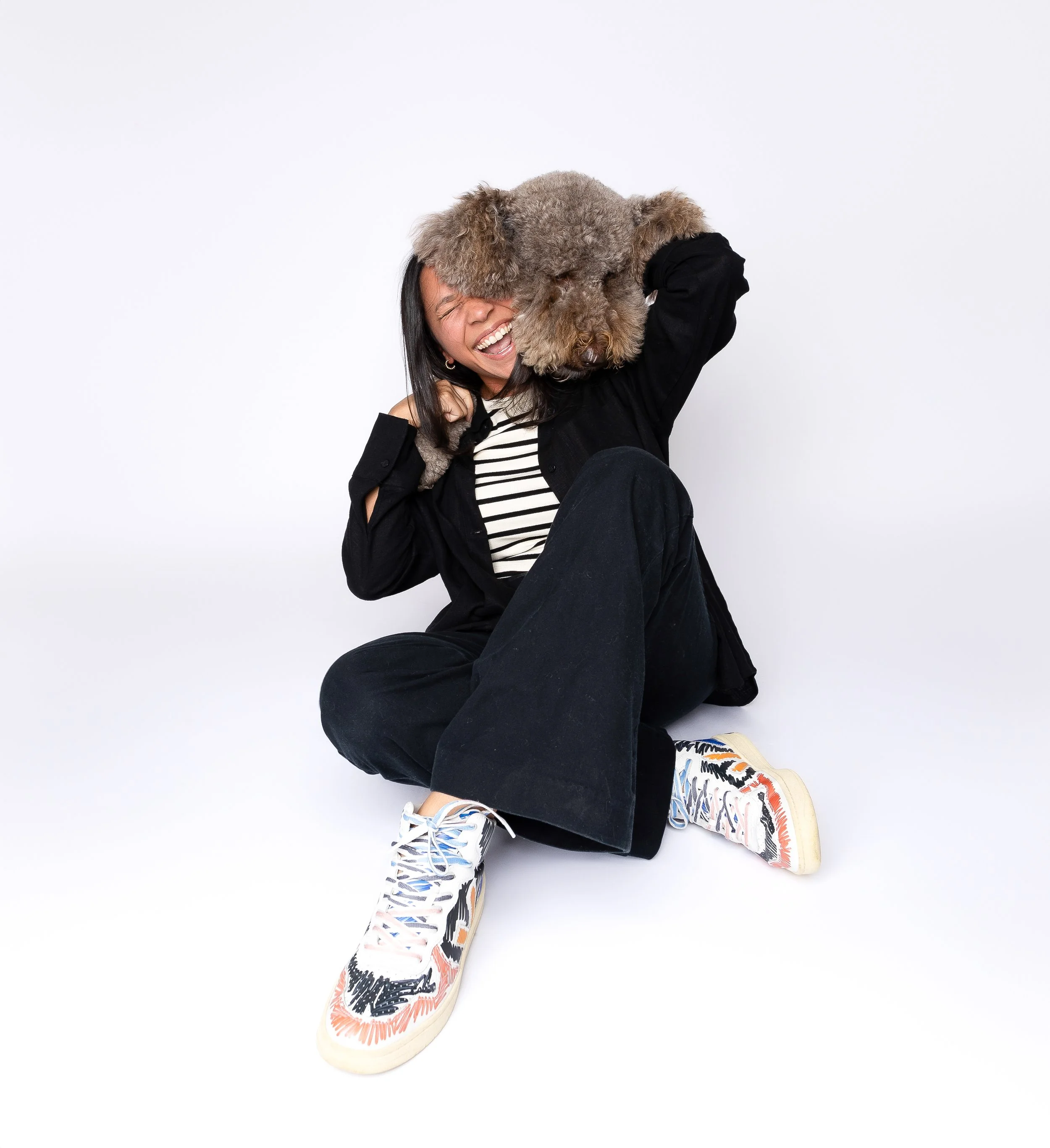 Mariale Hernandez with her dog Maverick at the Alibombo design studio