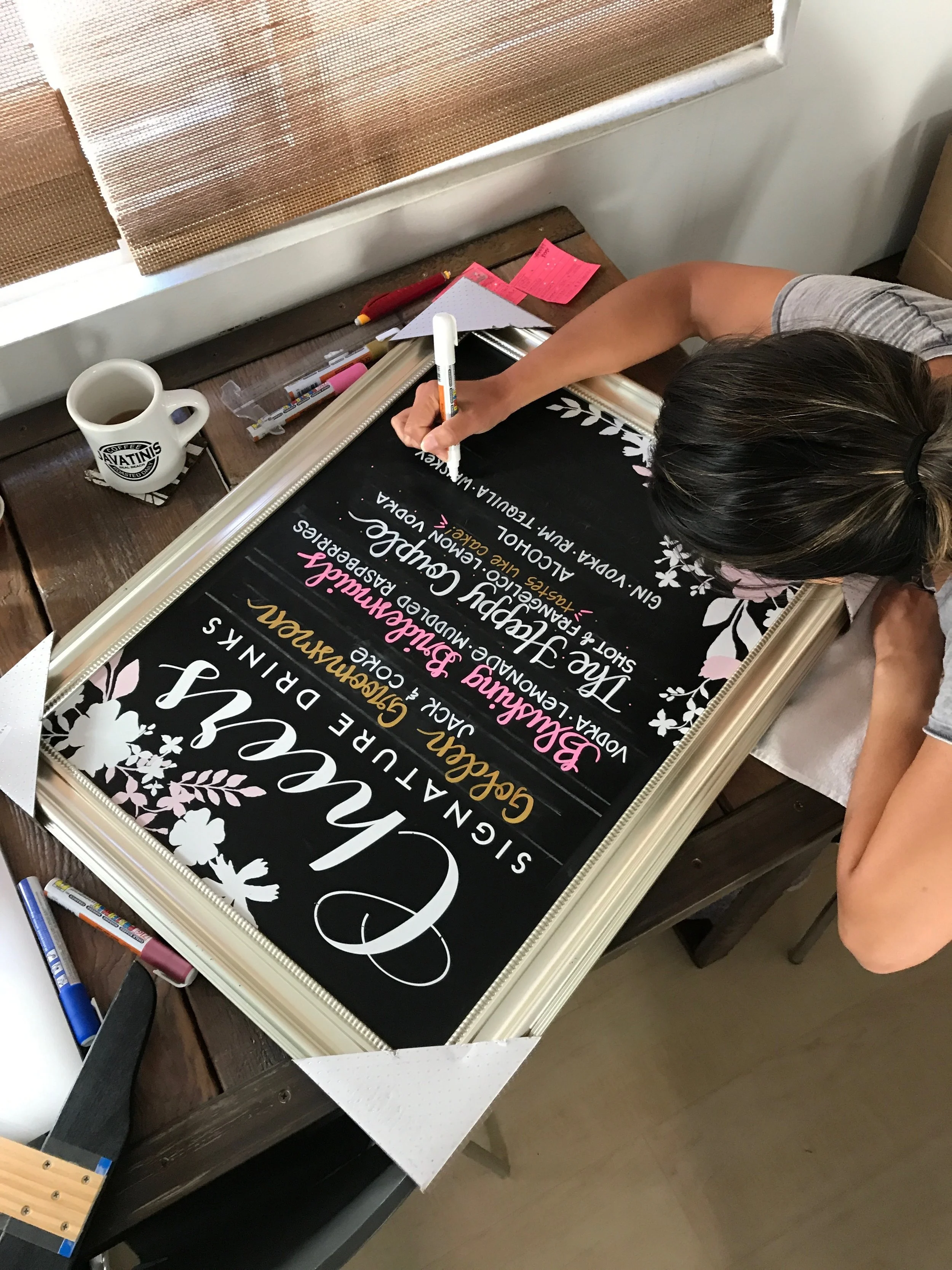 The corner flowers and "Cheers/Signature Drinks" came with the chalkboard. Everything else is hand-lettered.